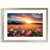 Framed wall art featuring a serene landscape design with vibrant green fields and a soft blue sky, elegantly showcased in a silver frame with a mat. Perfect for home decor.
