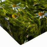 Close-up of a stretched canvas wall art piece depicting vibrant landscape fields, showcasing lush green hills and a clear blue sky, ideal for home decor.