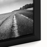 Framed canvas art showcasing a vibrant landscape scene with golden fields under a blue sky, emphasizing rich colors and intricate details, perfect for home decor.