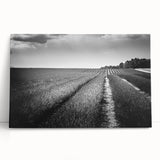 Stretched canvas wall art depicting a serene landscape with vibrant green fields and a blue sky, ideal for home decor or office spaces, showcasing nature's beauty.