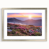 Silver-framed wall art featuring a serene landscape with fields, showcasing vibrant green hues and soft blue skies, ideal for home decor enhancement.