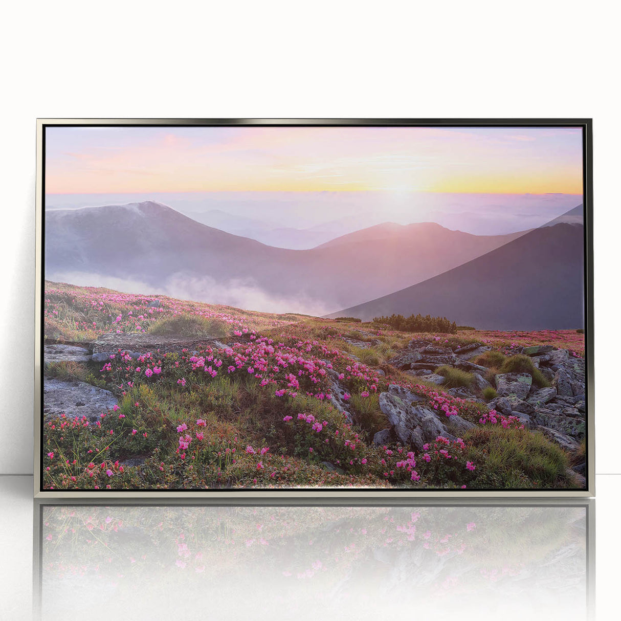 Framed acrylic wall art featuring a vibrant landscape with lush green fields and a serene sky, designed to enhance modern home decor. Silver frame adds elegance.