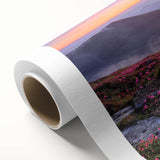 Vibrant rolled canvas showcasing a colorful landscape design, featuring rolling hills and a bright blue sky, ideal for enhancing home decor with a natural touch.