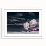 Framed wall art featuring a serene landscape with fields and soft colors, displayed in a white mat and sleek frame, perfect for home decor enhancement.