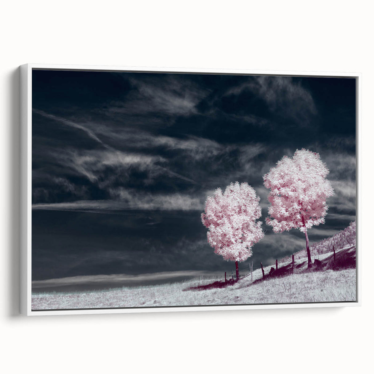Framed canvas wall art showcasing a serene landscape with vibrant green fields and a blue sky, designed for home decor, displayed in a white frame.