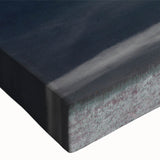 Close-up of a stretched canvas artwork showcasing a vibrant landscape design with fields and abstract patterns, ideal for home decor or gallery display.