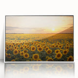 Framed wall art featuring a serene landscape with vibrant green fields and a clear blue sky, elegantly displayed in a white frame, perfect for home decor.