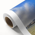 Vibrant rolled canvas featuring a stunning landscape design with lush green fields and a serene blue sky, ideal for home decor. Packaged securely in a cardboard tube for safe delivery.