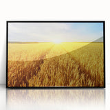 Framed wall art featuring a serene landscape design with lush green fields and a vibrant blue sky, showcasing a modern acrylic finish in a sleek black frame.