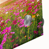 Close-up of a vibrant acrylic wall art piece showcasing a serene landscape with rolling fields and soft clouds, ideal for modern home decor.