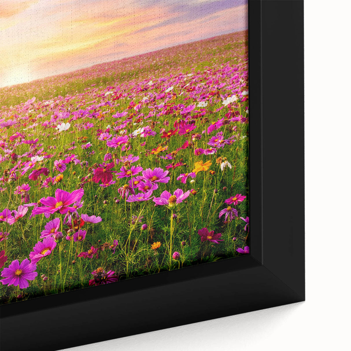 Close-up of a framed canvas wall art piece depicting a vibrant landscape of rolling fields, featuring rich greens and earthy tones, perfect for home decor.