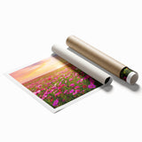 Vibrant rolled canvas print showcasing a serene landscape with rolling fields and a sunset, designed for wall art collection, elegantly packaged for display.