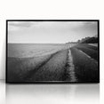 Framed acrylic wall art featuring a vibrant landscape of rolling fields in earthy tones, mounted in a sleek black frame, ideal for modern home decor.