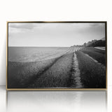 Framed wall art featuring a vibrant landscape design with golden accents, showcasing fields and nature, ideal for home decor or modern interiors.
