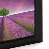 Close-up of a framed canvas wall art piece showcasing a vibrant landscape design with lush green fields and a serene blue sky, perfect for home decor.