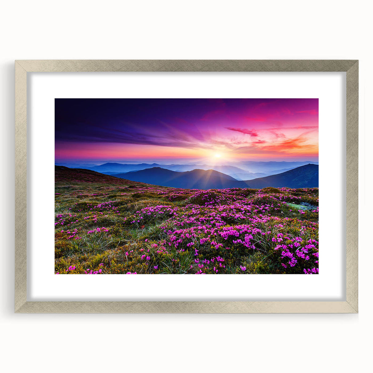 Framed wall art collection featuring serene landscapes of rolling green fields, displayed in an elegant silver frame with a white mat, ideal for home decor.