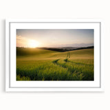 Framed wall art featuring a serene landscape scene with lush green fields and a blue sky, presented in a white mat and frame, perfect for home decor.