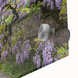 Close-up of a vibrant acrylic glass artwork depicting a serene garden landscape with lush greenery and colorful flowers, perfect for home decor.