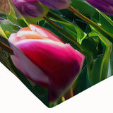 Close-up of a stretched canvas wall art featuring a vibrant garden landscape design, showcasing lush greenery and colorful flowers, perfect for home decor.