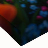 Close-up view of a stretched canvas wall art piece showcasing a vibrant landscape design with lush greenery and colorful flowers, perfect for home decor.