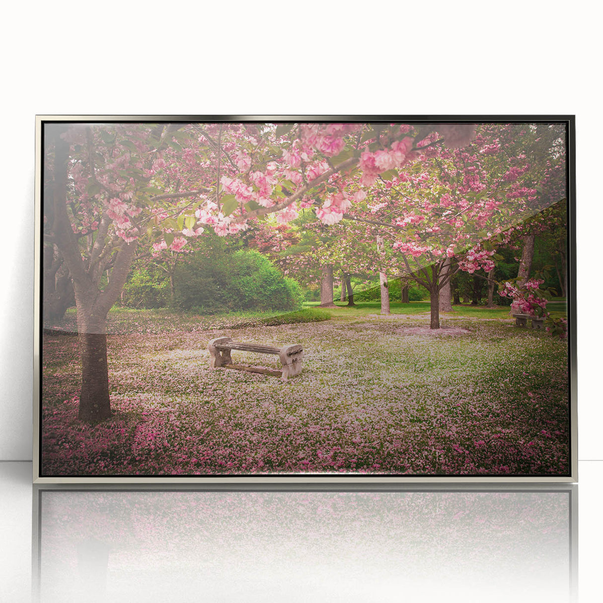 Framed acrylic wall art showcasing a vibrant landscape garden design, featuring lush greenery and colorful flowers, presented in a sleek silver frame for an elegant touch.