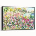 Framed canvas wall art showcasing a vibrant landscape garden design, featuring lush greenery and colorful blooms, presented in a sleek black frame from a side view.