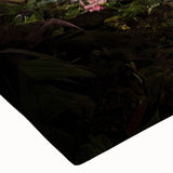 Close-up of a vibrant stretched canvas artwork showcasing a lush garden landscape with colorful flowers and greenery, perfect for home decor.