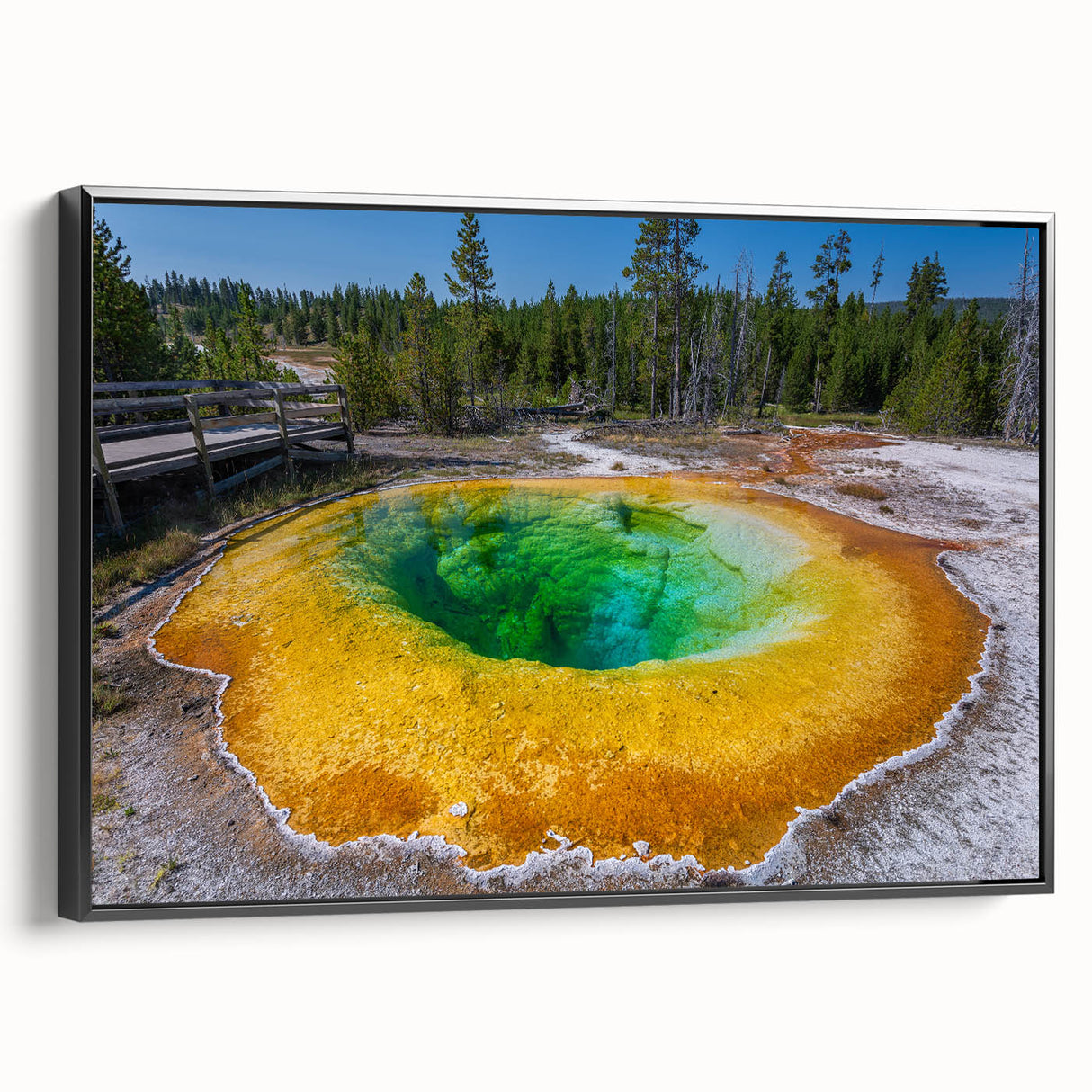 Framed wall art showcasing a geyser landscape design in a black frame, highlighting vibrant colors and intricate details, perfect for modern home decor.