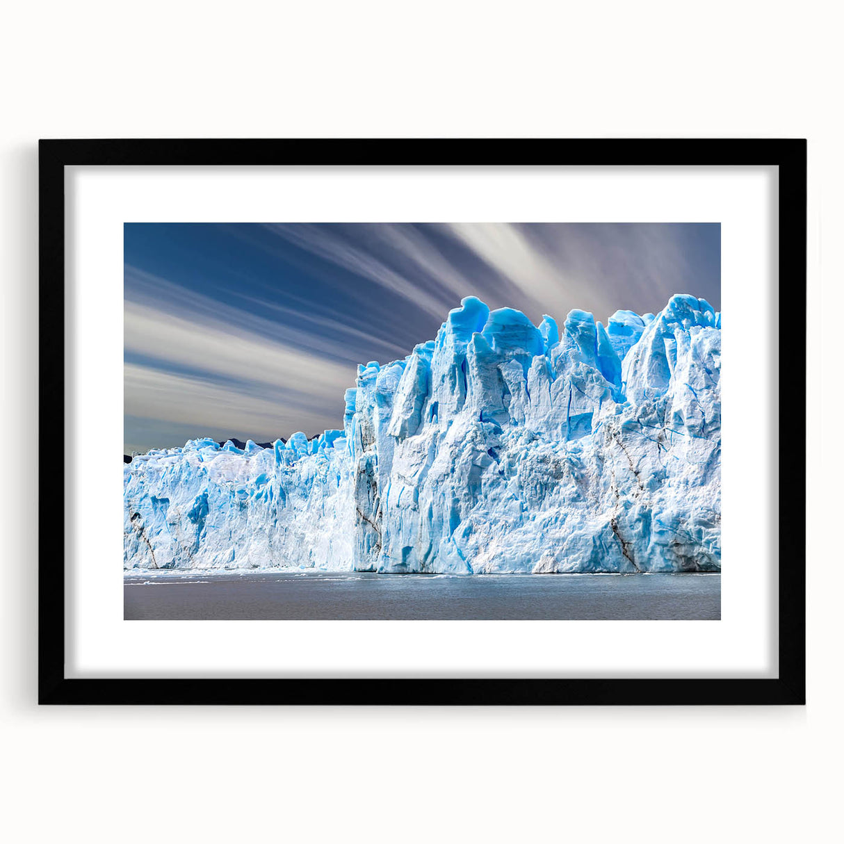 Black-framed wall art featuring a stunning glacier landscape design, showcasing vibrant blue and white hues, ideal for enhancing modern home decor.