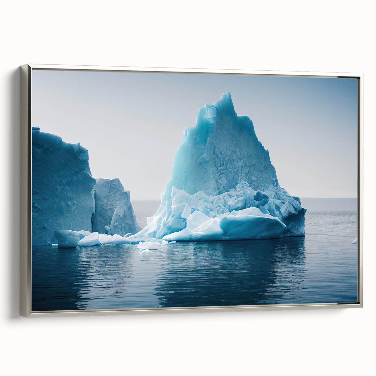 Framed wall art featuring a stunning glacier landscape design, showcasing vibrant blues and whites, elegantly displayed with a sleek silver frame for modern decor.