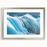 Framed wall art featuring a stunning glacier landscape design in a silver frame with a mat, ideal for enhancing modern home decor and interior aesthetics.