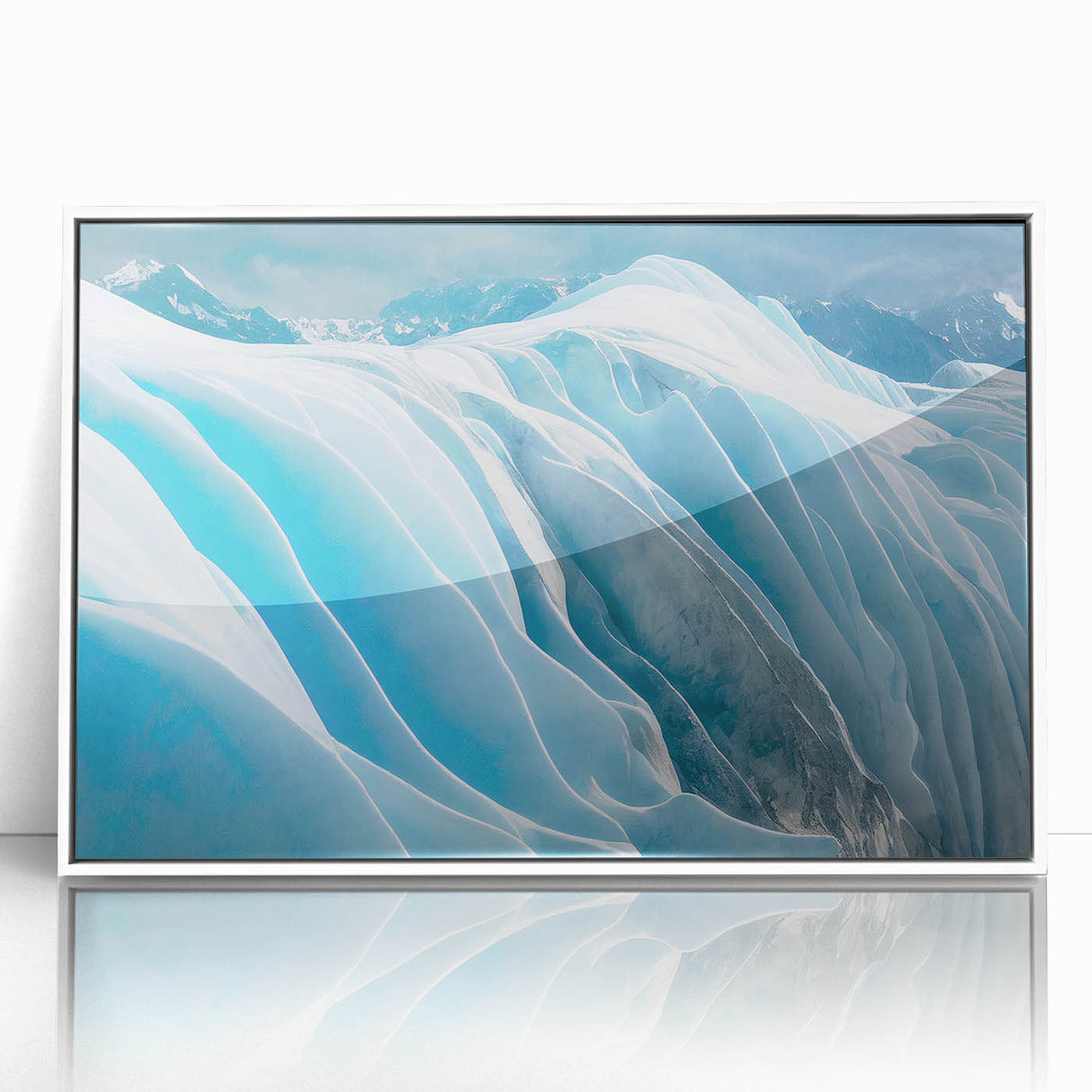 Framed acrylic wall art featuring a stunning glacier landscape design in vibrant blues and whites, presented in a sleek white frame for modern decor enhancement. Perfect for nature lovers and interior decoration.