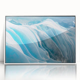 Framed acrylic wall art featuring a stunning glacier landscape design in vibrant blues and whites, presented in a sleek white frame for modern decor enhancement. Perfect for nature lovers and interior decoration.