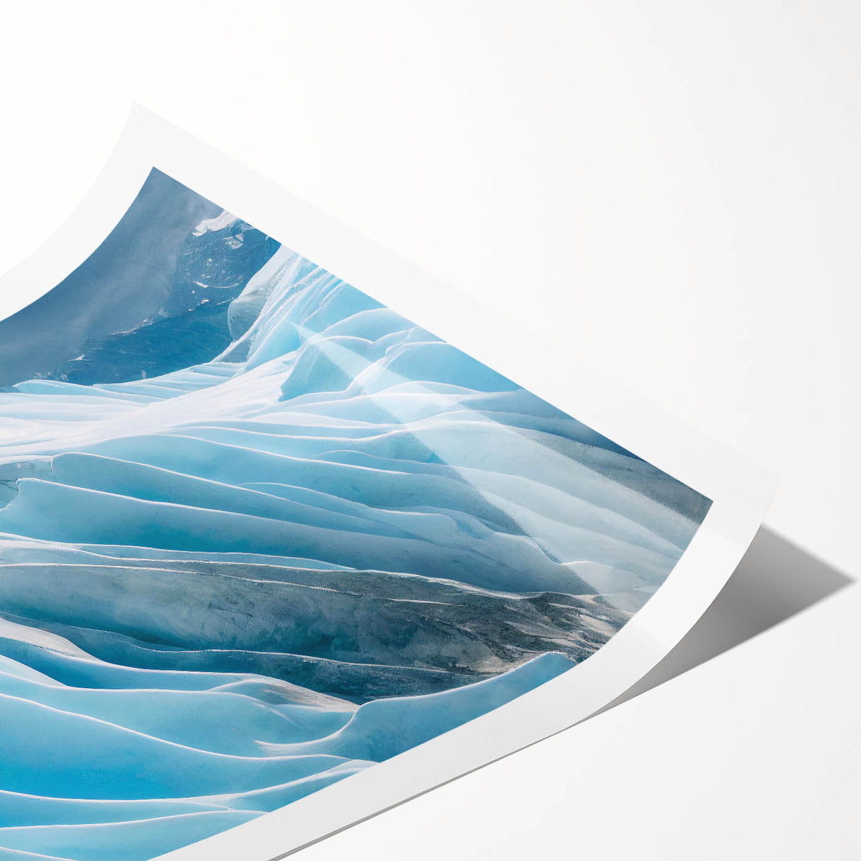 Glacier-inspired wall art print showcasing vibrant blues and whites, capturing icy landscapes, rolled for easy transport and display in any space.