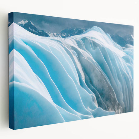 Stretched canvas wall art showcasing a stunning glacier landscape design with vibrant blues and whites, ideal for adding a serene touch to home decor.