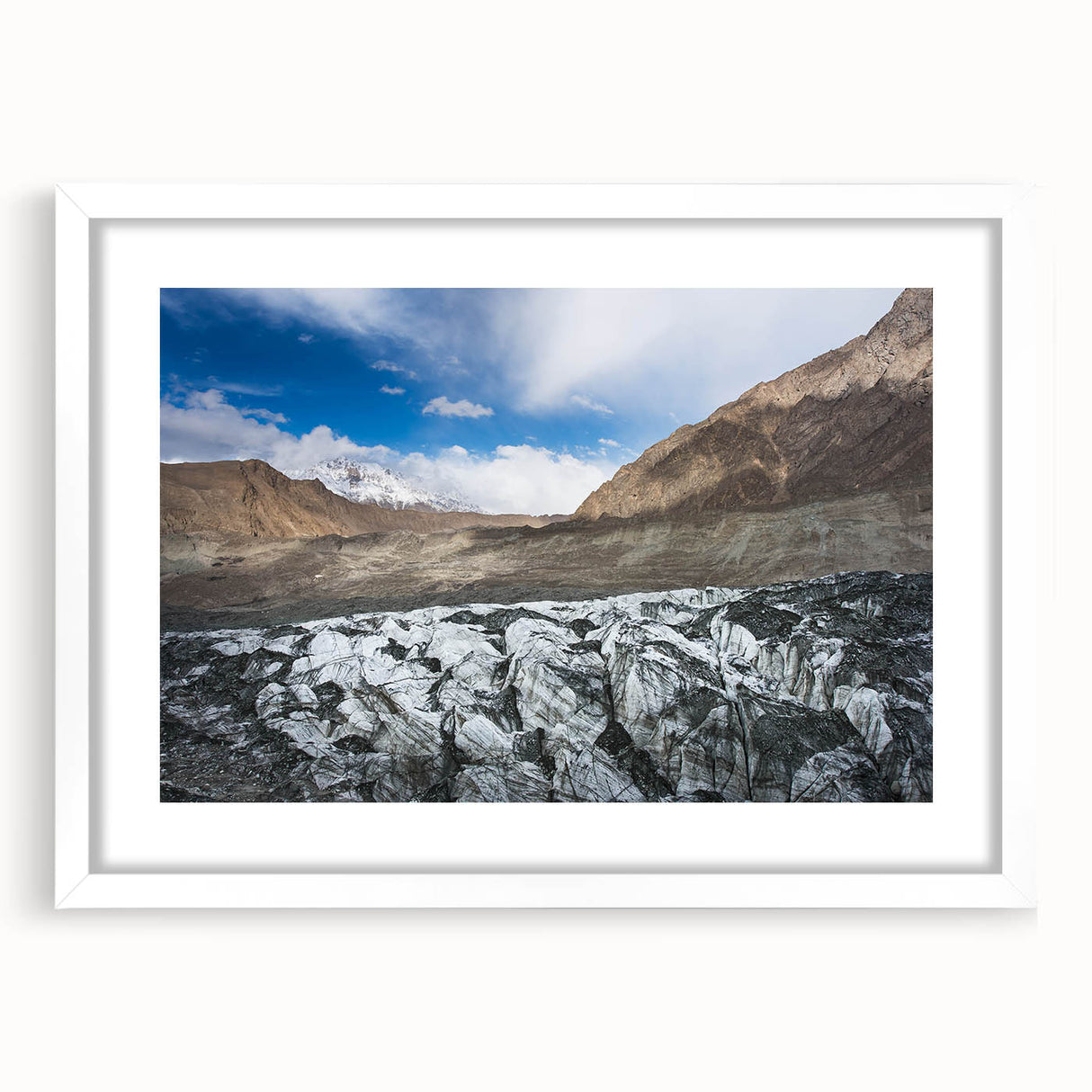 Framed landscape wall art featuring a stunning glacier design, showcasing vibrant blue and white colors, with a sleek white mat for an elegant finish. Perfect for home decor.