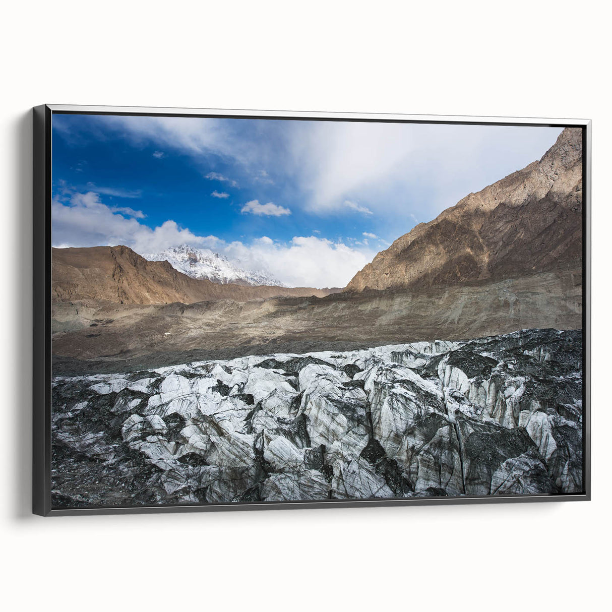 Framed canvas wall art featuring a stunning glacier landscape design, showcasing icy blues and whites, with a sleek black frame, ideal for modern decor.