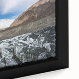 Close-up of a framed canvas wall art piece showcasing a stunning glacier landscape design, featuring vibrant blues and whites, perfect for home decor.