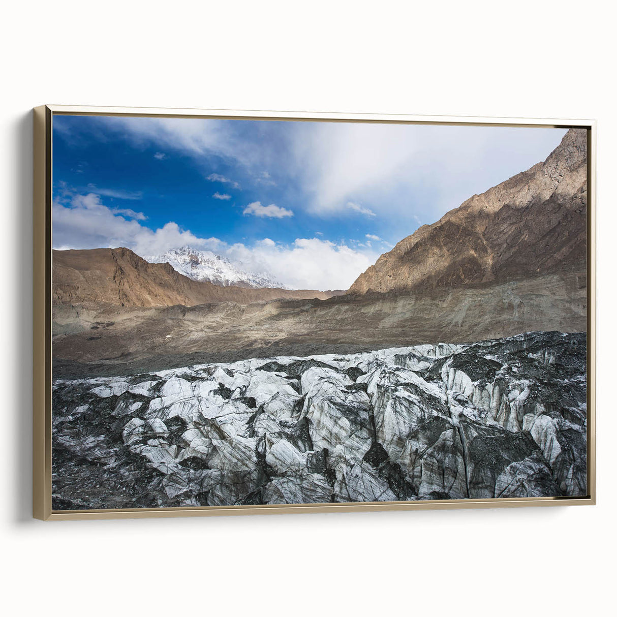 Framed wall art featuring a stunning glacier landscape design with gold accents, showcasing vibrant blues and whites, perfect for adding elegance to any decor.