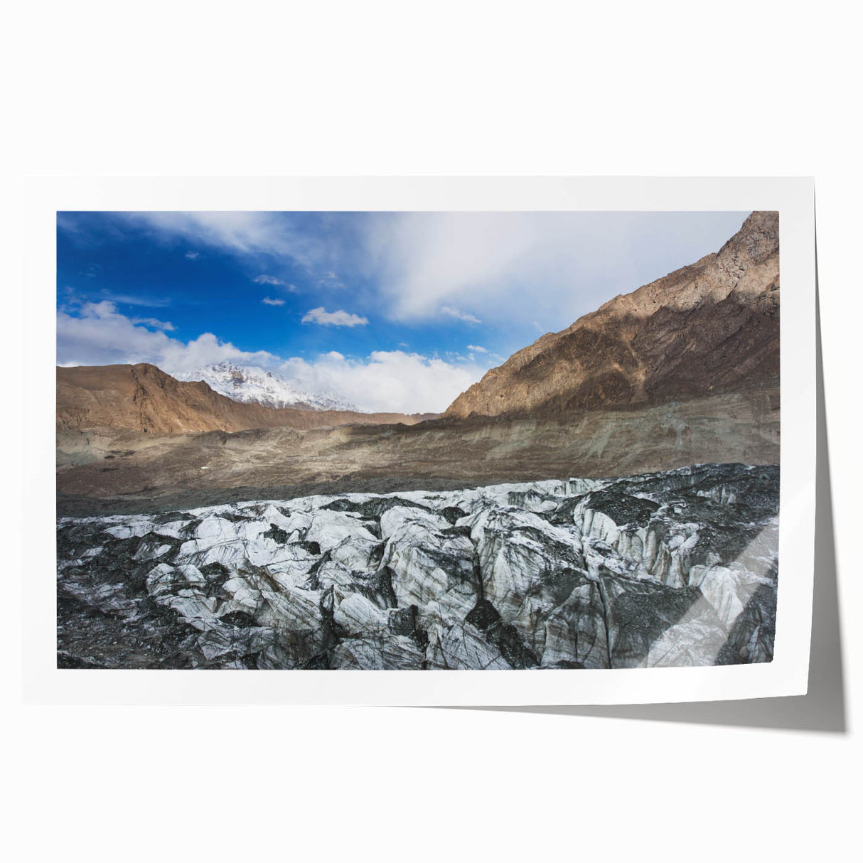 Vibrant rolled print showcasing a stunning glacier landscape design, featuring icy blues and whites, ideal for home decor in a modern setting.