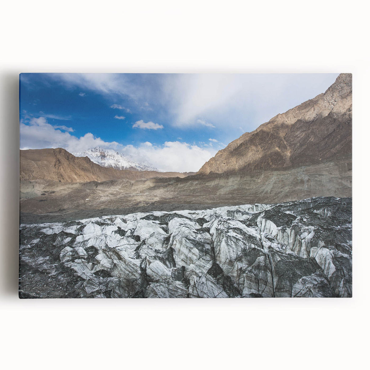 Stretched canvas wall art depicting a stunning glacier landscape with vibrant blues and whites, perfect for home decor and nature enthusiasts, showcasing intricate details and depth.