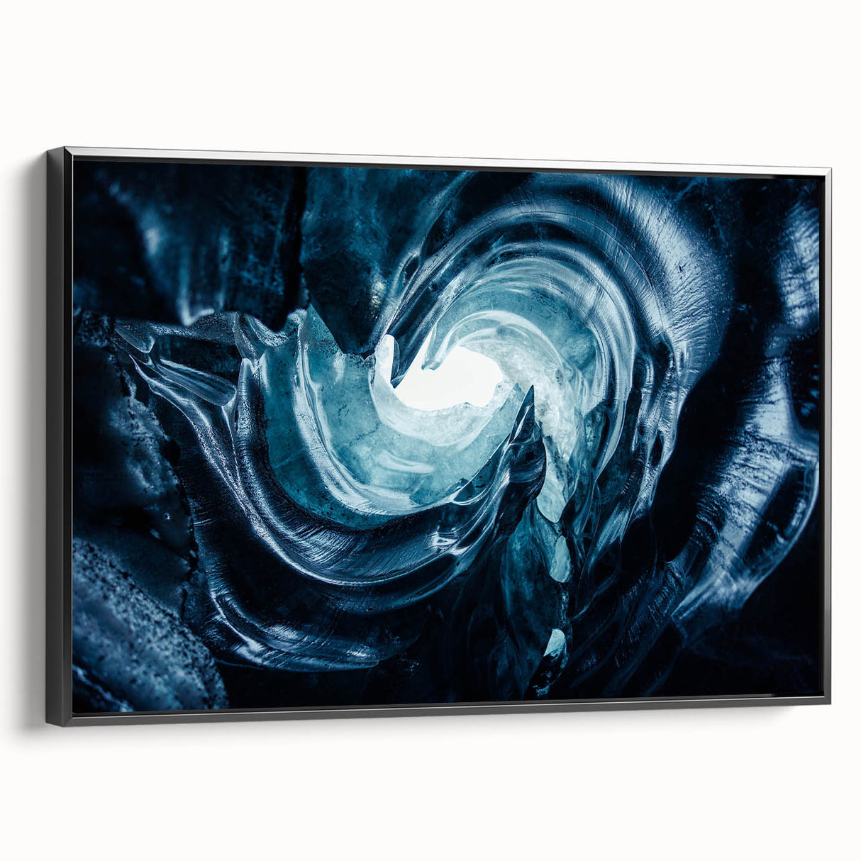 Framed canvas wall art showcasing a stunning glacier landscape design, featuring vibrant blues and whites, with a sleek black frame enhancing its modern aesthetic.