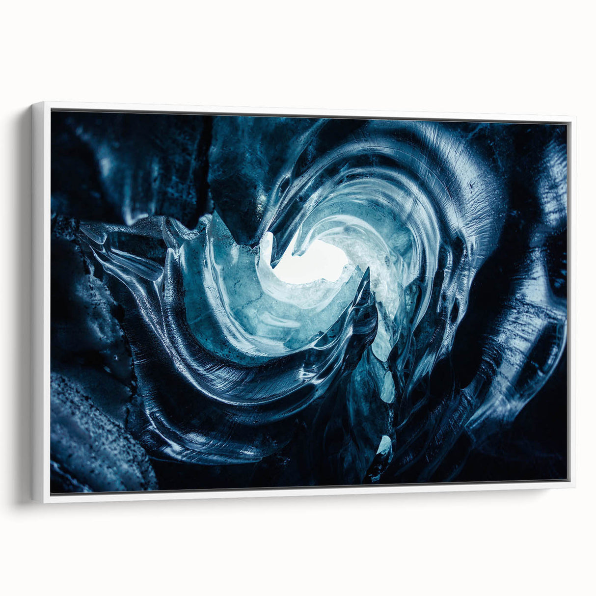 Framed canvas wall art depicting a stunning glacier landscape with vibrant blue and white tones, showcased from a side view against a minimalist white background. Ideal for contemporary home decor.