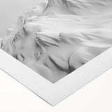 Rolled canvas showcasing a stunning glacier landscape design with vibrant blues and whites, ideal for home decor, packaged securely in a protective cardboard tube.