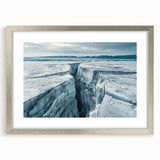 Framed wall art featuring a stunning landscape design of a glacier, showcased in a sleek silver frame with a white mat, ideal for modern home decor.
