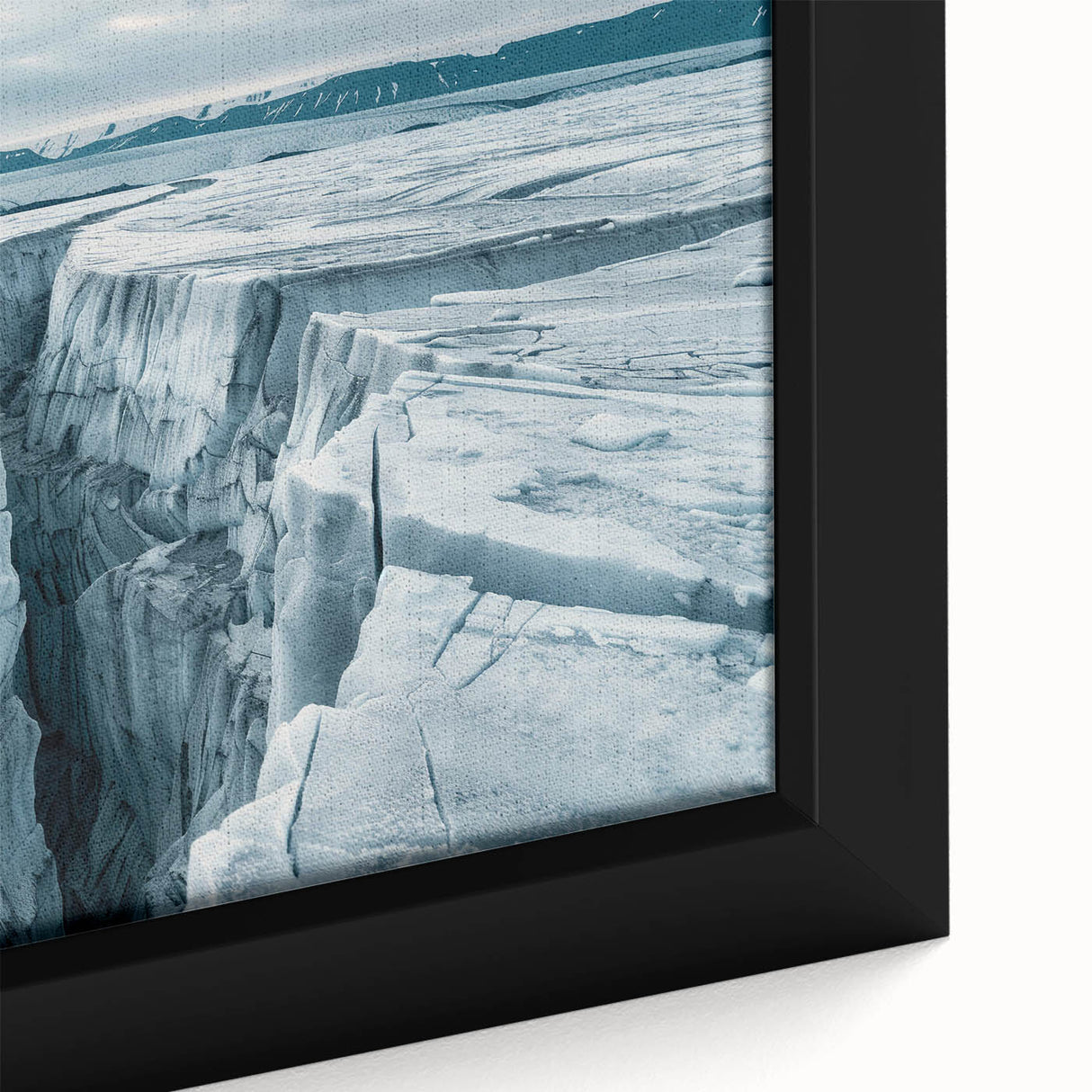 Framed canvas artwork showcasing a stunning close-up of a glacier landscape, featuring vibrant blues and whites, perfect for enhancing modern home decor.