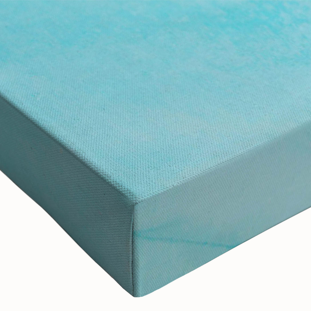 Close-up of a stretched canvas wall art piece showcasing a stunning glacier landscape design, featuring vibrant blues and whites, perfect for modern decor.