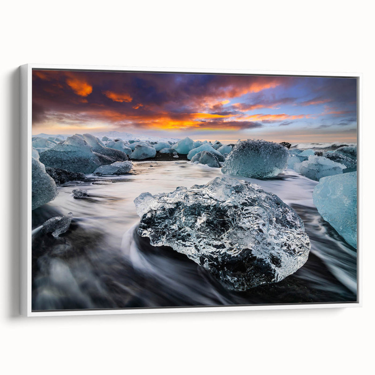 Framed canvas wall art showcasing a stunning glacier landscape design, featuring cool blue and white tones, displayed from a side view against a neutral backdrop.