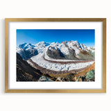 Framed wall art featuring a stunning glacier landscape design, accented with a gold frame and mat, perfect for modern home decor. The artwork showcases icy blues and whites, creating a serene and captivating focal point for any room.
