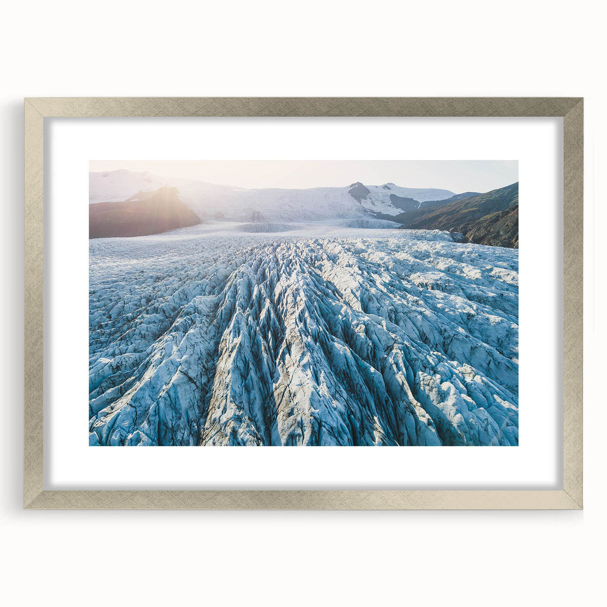 Glacier design wall art collection featuring a silver frame with mat, showcasing a serene landscape scene in soft colors, ideal for modern home decor.